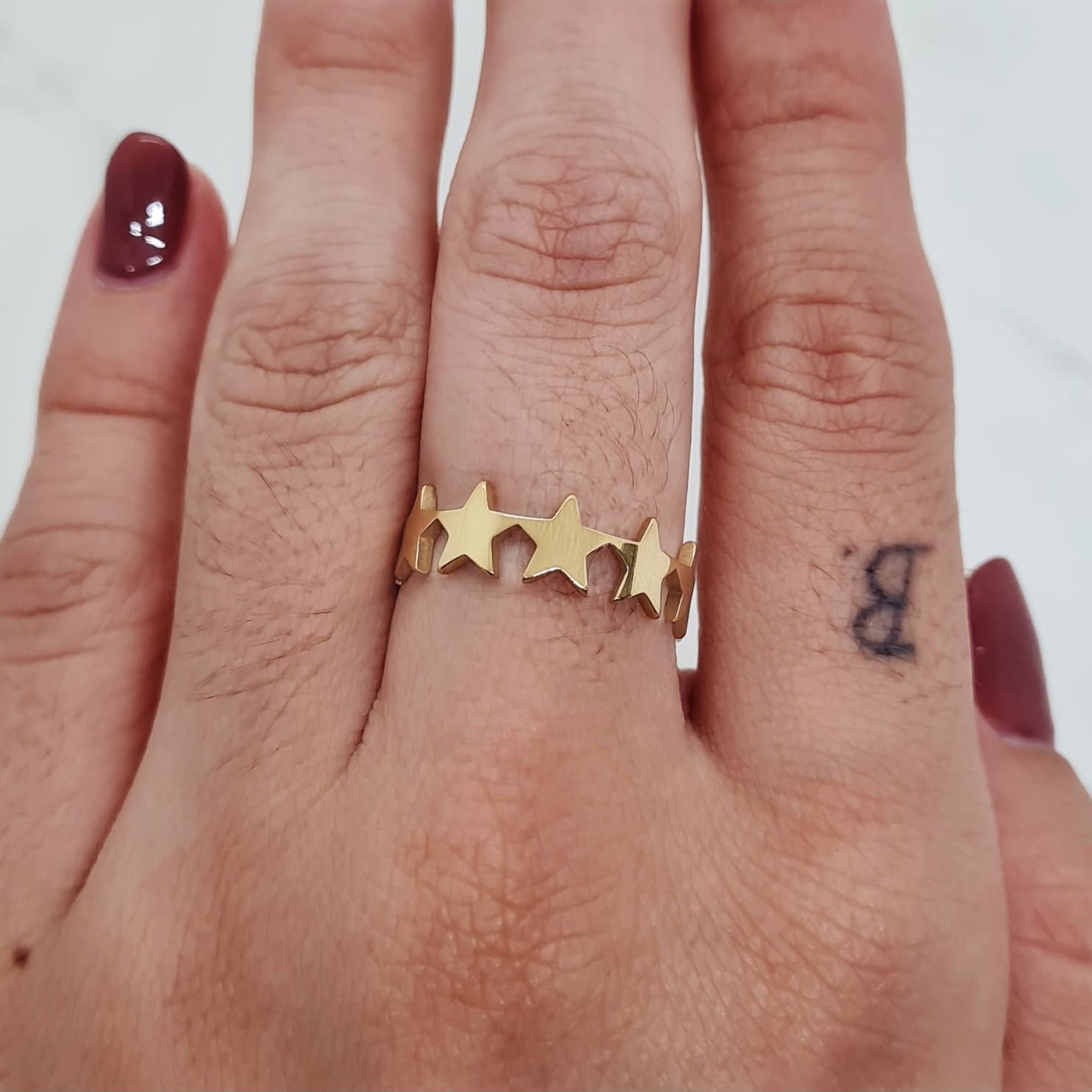 Imagen de producto ANILLO ACERO DORADO - ESTRELLAS CONTINUAS LISAS