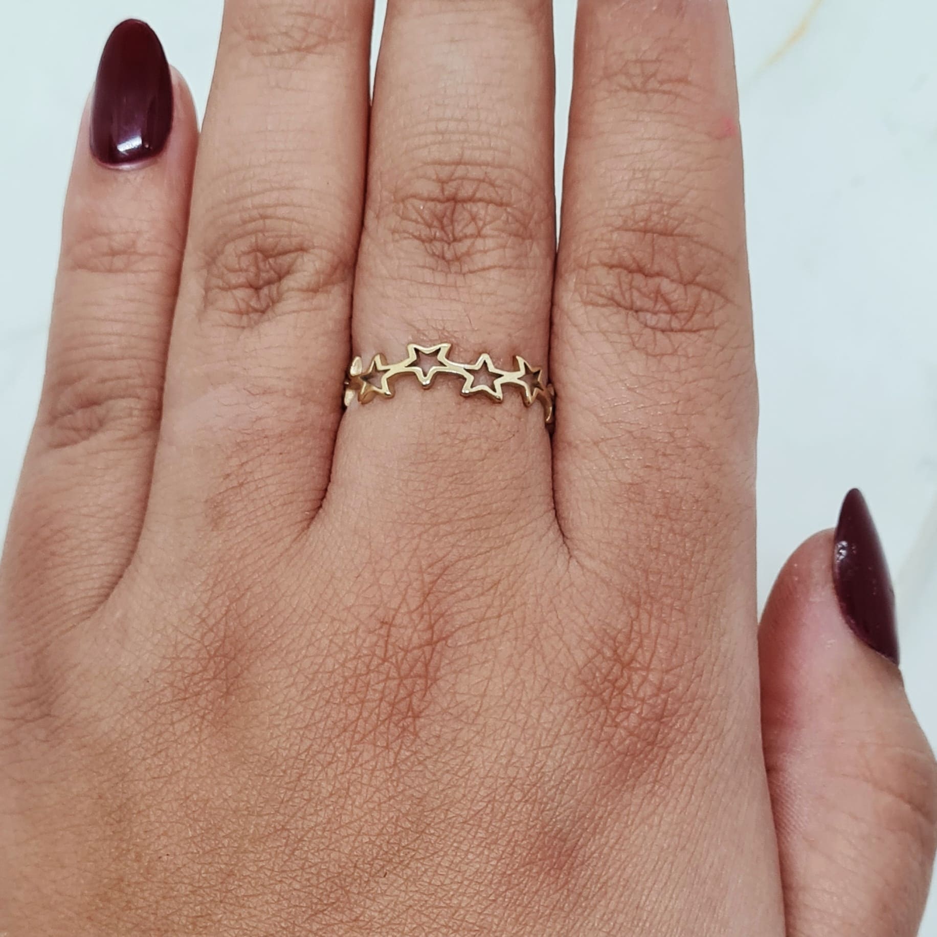 Imagen de producto ANILLO ACERO DORADO - ESTRELLAS CALADAS