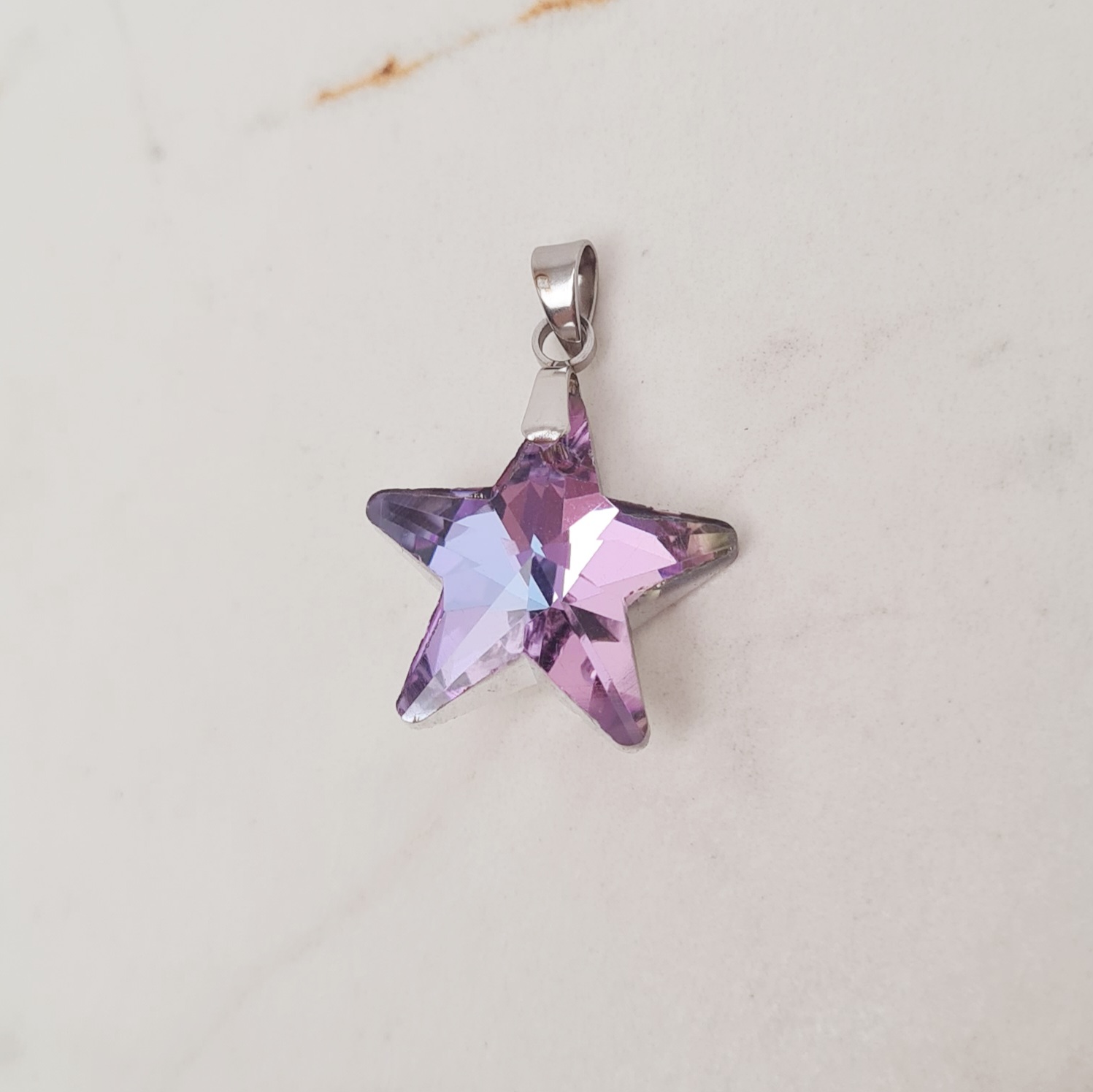 Imagen de producto DIJE CRISTAL TORNASOLADO VIOLETA - ESTRELLA