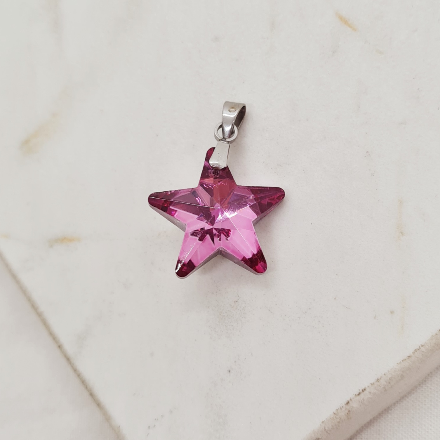 Imagen de producto DIJE DE CRISTAL - ESTRELLA ROSA