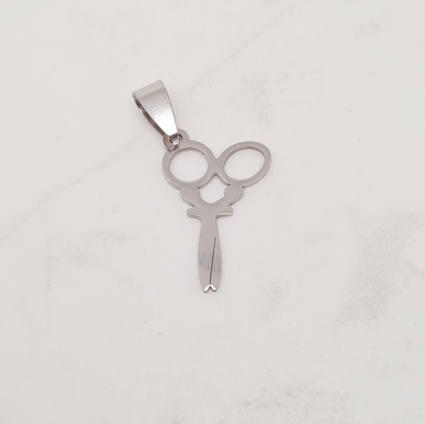 Imagen de producto DIJE PELUQUERIA