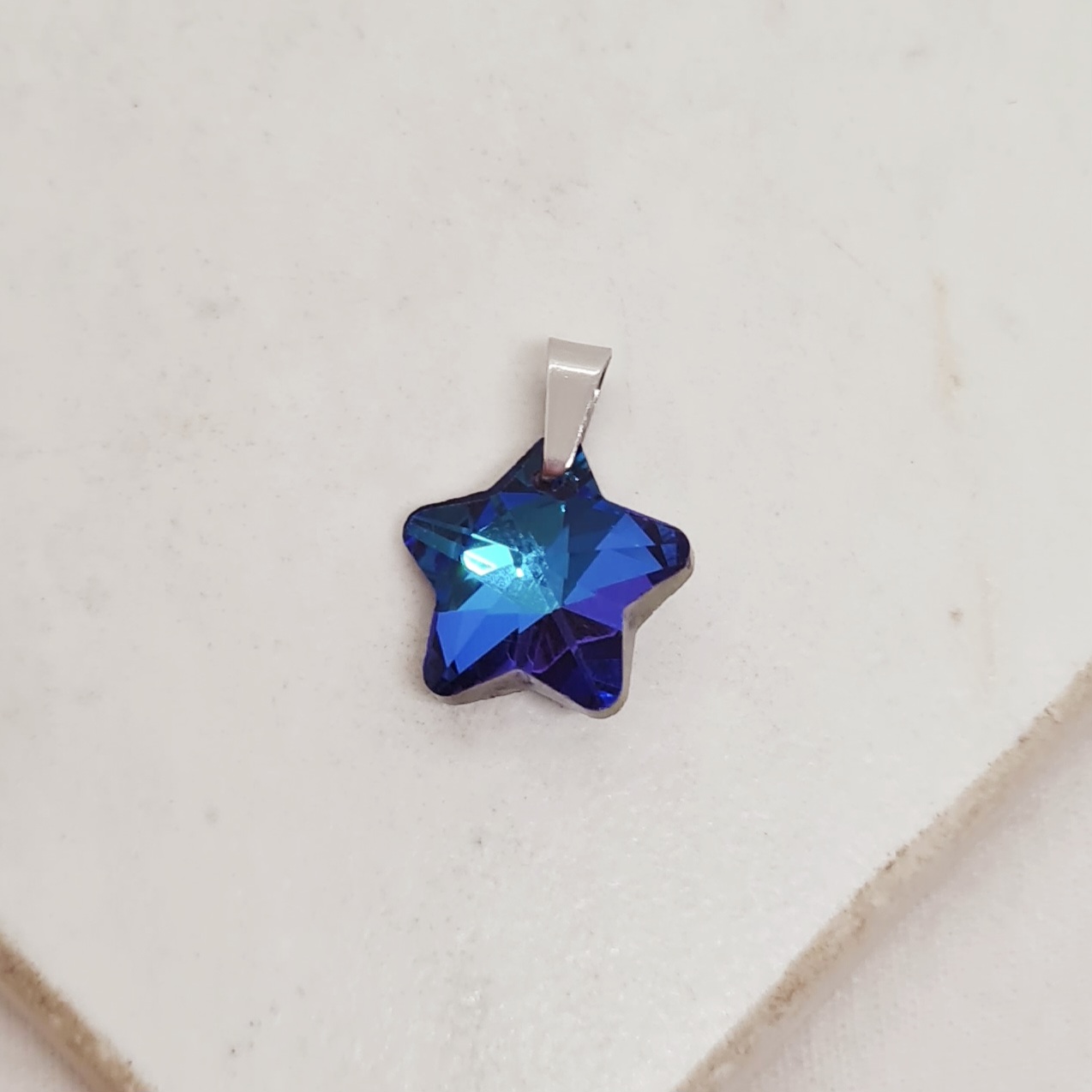Imagen de producto DIJE DE CRISTAL CHICO - ESTRELLA AZUL