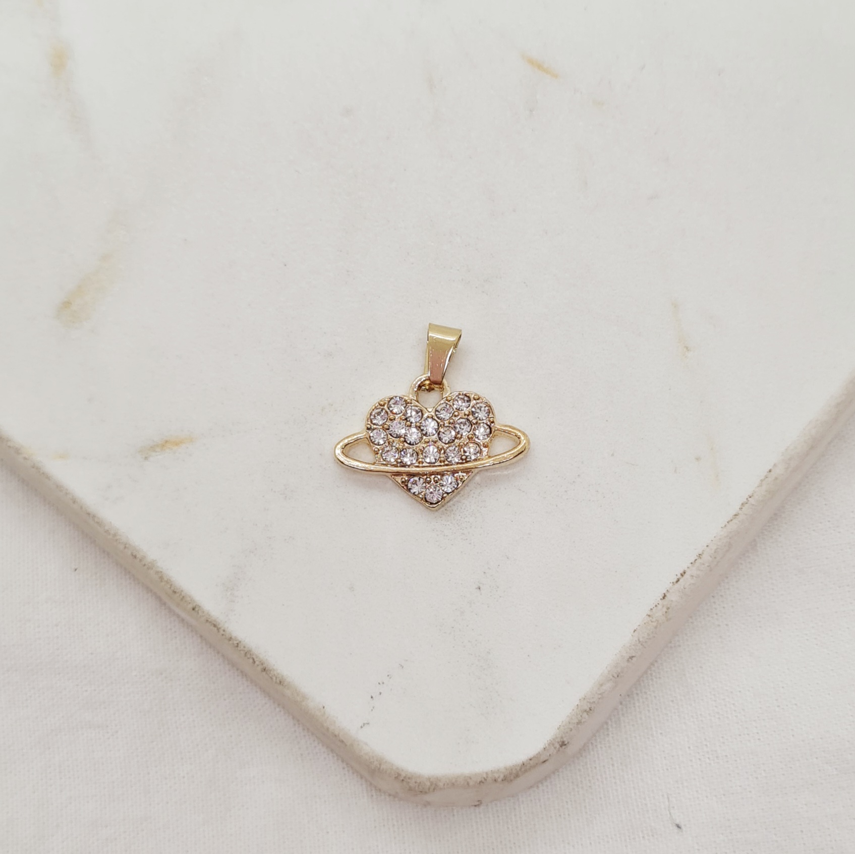 Imagen de producto DIJE ACERO DORADO - CORAZON CON STRASS Y ANILLO