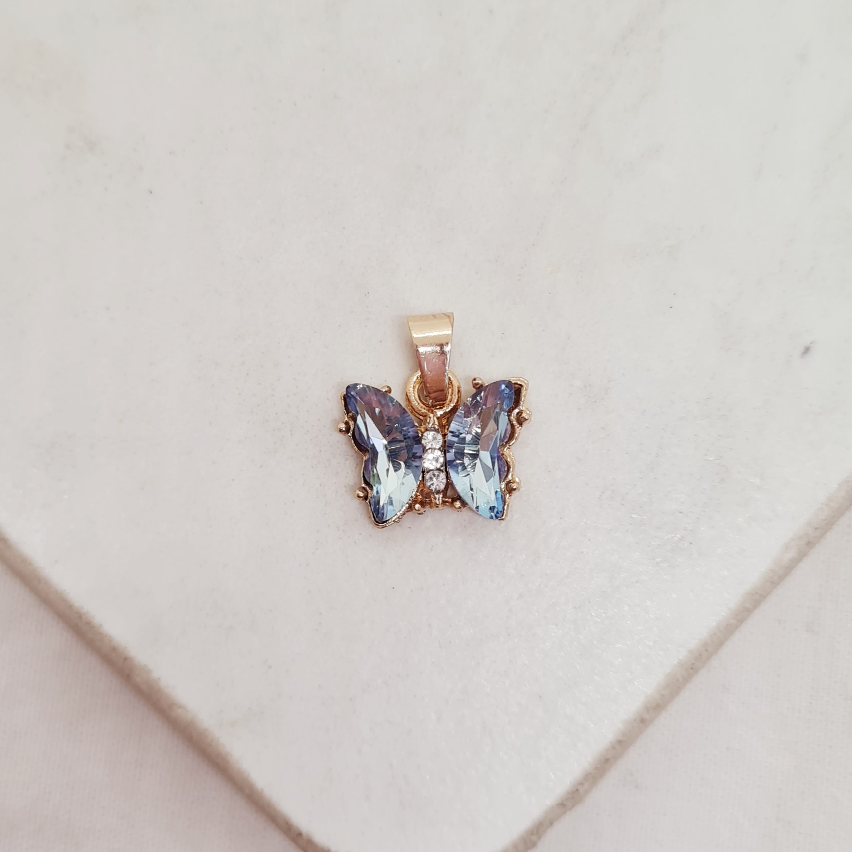 Imagen de producto DIJE ACERO DORADO MARIPOSA ENGARZADA CHICA - CELESTE
